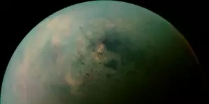 This false-color mosaic, made from infrared data collected by NASA's Cassini spacecraft, reveals the differences in the composition of surface materials around hydrocarbon lakes at Titan, Saturn's largest moon. To human eyes Titan would look Orange. Image released Oct. 23, 2013.